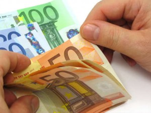 Man's hands counting euro notes