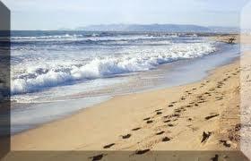 orme sulla sabbia